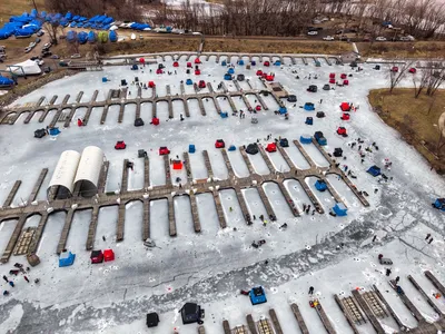 Aerial shot of ice fishing tents on a frozen lake in Wabasha, Minnesota during winter.